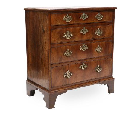A George II Figured Walnut Straight-Front Chest of Drawers, 2nd quarter 18th century, the moulded top above four oak-lined gr