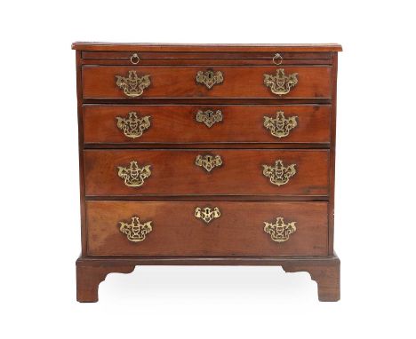 A George III Mahogany Bachelor's Chest, late 18th century, the moulded top above a pull-out brushing slide with four oak-line