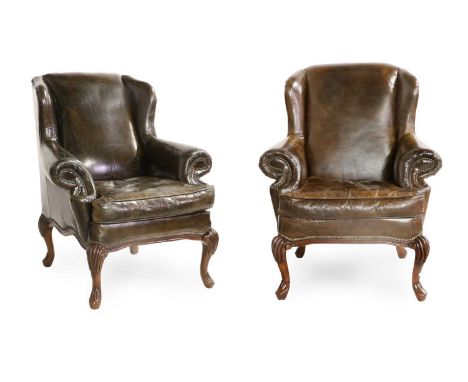A Pair of Reproduction Library Armchairs, covered in vintage-style close-nailed brown leather, with overstuffed arms and squa
