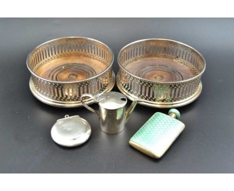 A pair of silver plated Georgian design bottle coasters, together with a miniature silver watering can, a silver pill box, an