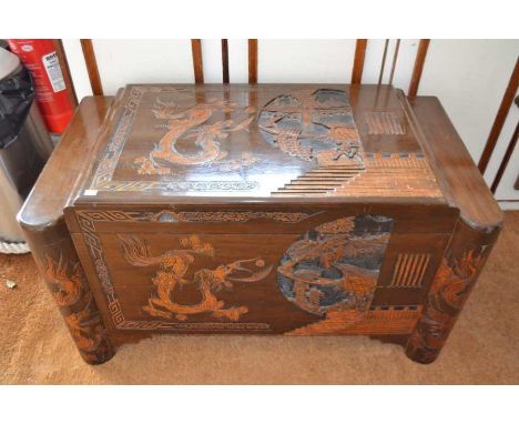A 20th century Chinese carved camphor wood coffer, the trunk has a hinged lid and removable tray, 101cm wide