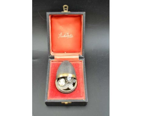 Stuart Devlin, A silver egg opening to reveal a frog on a lily pad, London 1972, gross weight:106g, in original box Condition