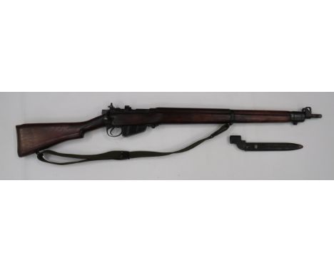 Deactivated No4 MKI Lease Lend Rifle .303, 25 1/4 inch barrel.  Front sight with protective ears.  Blackened breech with rear