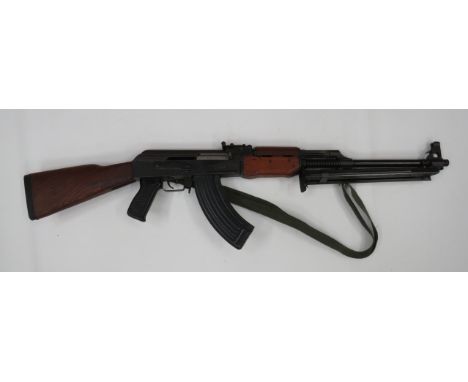 Deactivated Yugoslavian ZCZ AK Support Gun 5.56 mm, 21 1/2 inch, blued barrel with hooded front sight.  Top mounted gas port.