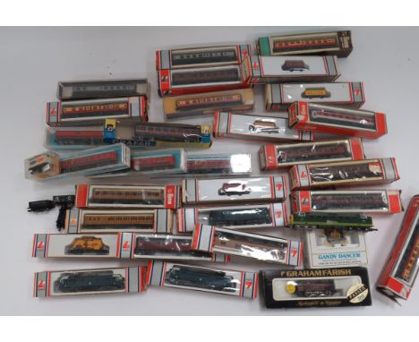 Good Selection of N Scale Micro Train Models and Track mostly produced by Lima and complete in maker boxes.  Including electr