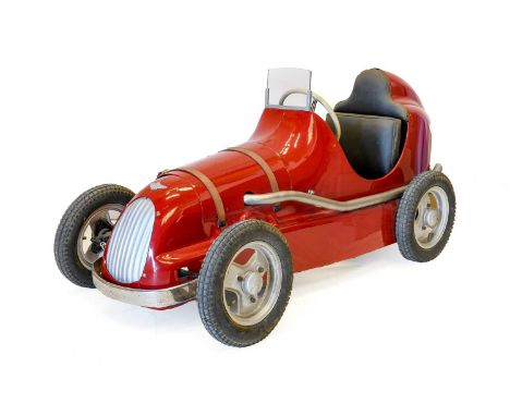 A Rare Austin 1940's Junior Pathfinder Special Pedal Car, with red livery, leather bonnet straps and pneumatic tyres, 160cm l