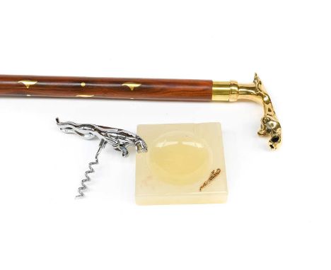 Jaguar Interest: an onyx ashtray with Jaguar emblem, a chromium-plated corkscrew, and a teak and brass inlaid walking stick, 