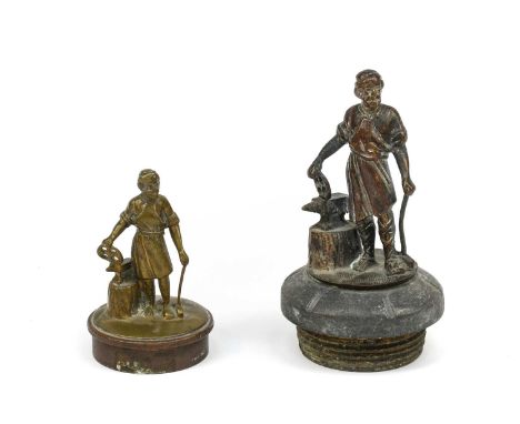 An Early 20th Century Solid Brass Car Mascot, in the form of a blacksmith with anvil, mounted on a vintage radiator cap, 12cm