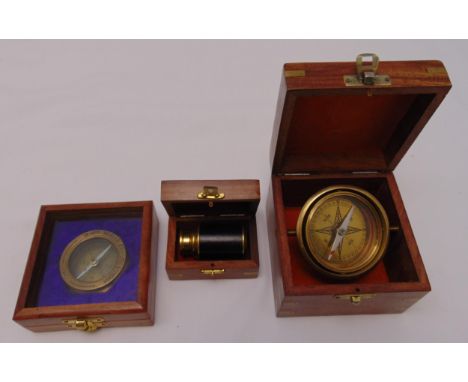 Three cased scientific instruments to include a miniature telescope and two compasses in fitted mahogany cases