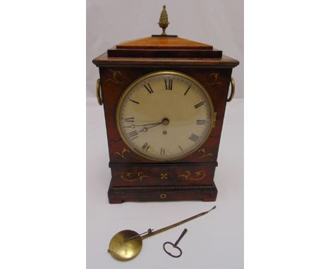 A Regency bracket clock, rectangular inlaid with brass detail, the circular enamel dial with Roman numerals with brass side h