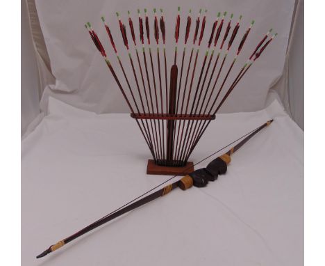 A novelty Mesoamerican wooden bow and arrow set