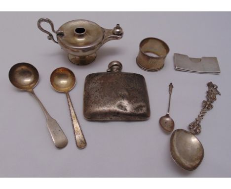 A quantity of hallmarked silver and white metal to include a hip flask, an oil lamp, a napkin ring and flatware, approx total