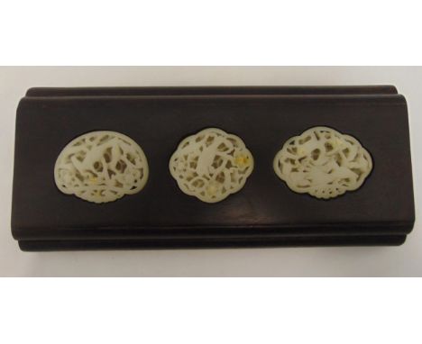 A Chinese hardwood rectangular stand inset with carved and pierced jade plaques, 26 x 11.5cm