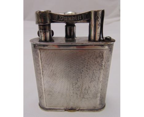 A Dunhill silver plated engine turned table lighter of rectangular form circa 1930s, A/F