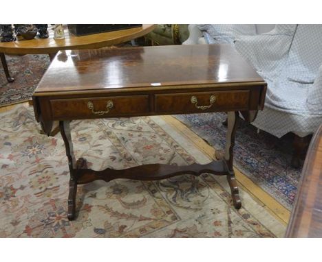 A Regency style satinwood crossbanded burr walnut sofa table, with shaped twin leaves, two frieze drawers, raised on scroll-c