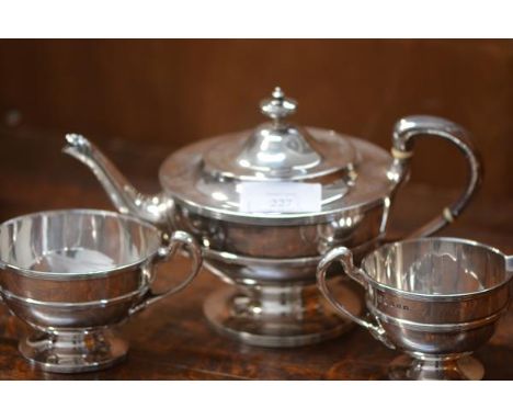 A George V Scottish silver three piece tea service, T.S. Cuthbert, Glasgow 1930, each piece of broad spherical form, applied 