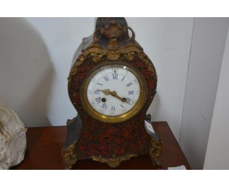 A 19th century gilt-metal and boullework mantel clock, the balloon case with a boullework panel, gilt-metal mounts in the Roc