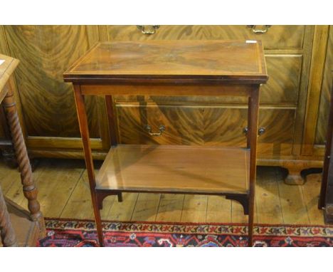 An Edwardian crossbanded and inlaid mahogany foldover card table, the rectangular quarter-veneered top swivelling and opening