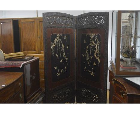 A Japanese two-fold lacquer and bone-mounted screen, each panel with fret-carved crest and frame enclosing a panel applied wi