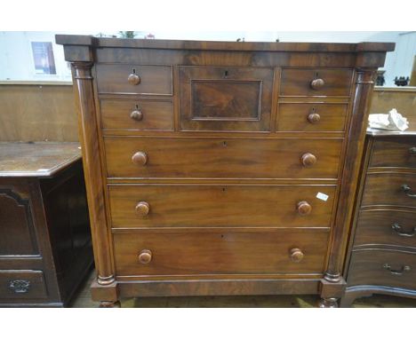 A Victorian mahogany "Scotch" chest, with inverted breakfront top over a conforming case fitted with a central deep drawer fl