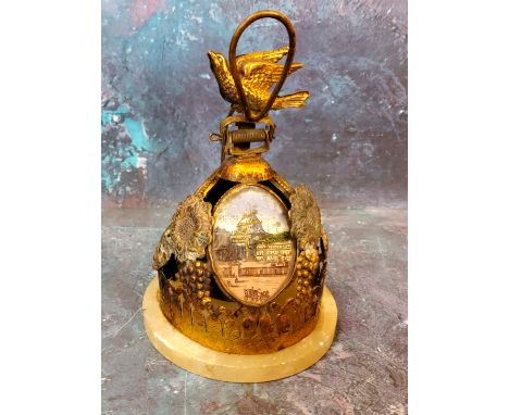 An unusual 19th century French gilt metal table bell, with three oval panels with Varsailles, Arc de Triomphe and Chateau, bi