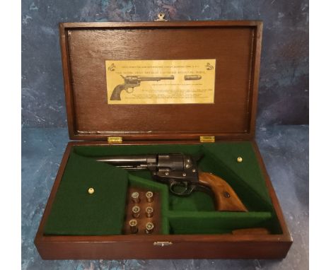 A replica Colt single action army .45 revolver, walnut grip, accessories including six reusable plug fire cartridges, cap sea