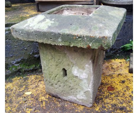 A Derbyshire gritstone garden planter plinth, the top a carved gatepost finial, the solid base, dressed into a rectangular sh