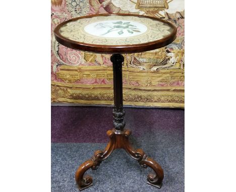 An unusual rosewood wine table, the dished glazed top inset with circular hand painted watercolour botanical study with drago