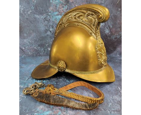 A Victorian brass Merryweather fireman's helmet,  ornate high comb, applied with emblem, leather liner and chin strap, c.1880