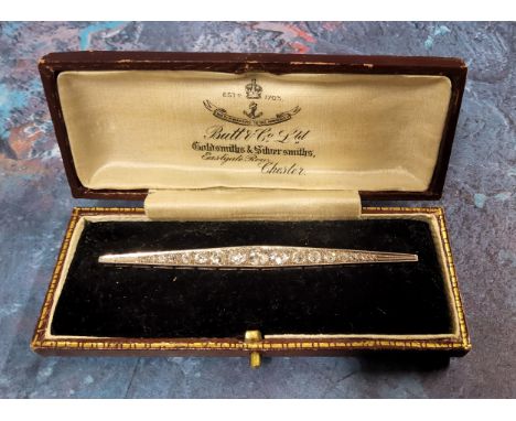 An Art Deco white metal &amp; diamond bar brooch, graduated old cut round diamonds, with a chenier gallery, pin &amp; locking