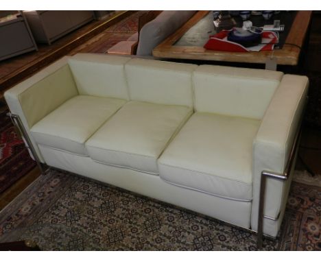 After Le Corbusier chrome and cream leather three seater sofa with loose cushion seat on tubular underframe, W:175cm