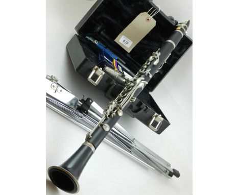 A boxed clarinet, serial no 264338, having Buffet Crampon reed case, together with stand 