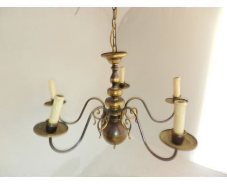 A Dutch style four branch chandelier, H. 45cm, together with a similar three branch and a larger eight branch light, (3)