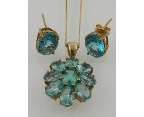 A 9 carat yellow gold and blue apatite oval cluster pendant, suspended on a 9 carat yellow gold chain, together with a pair o