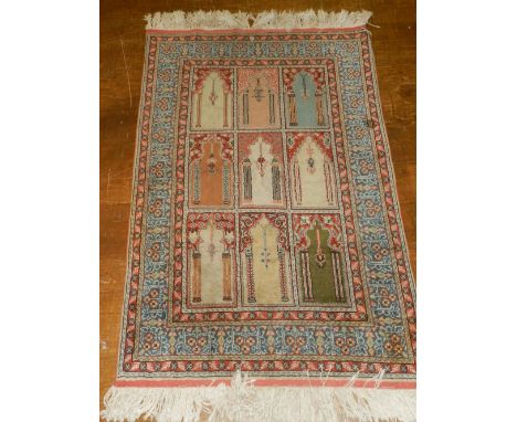 A Turkish Kayseri carpet, overall decorated with mirab medallions to centre within pale ground borders, fringed, L. 128cm, W.