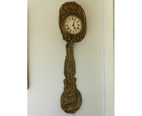 A comtoise wall clock, the cream dial with Roman and Arabic numerals, having repousee sheet brass to face and pendulum, chimi