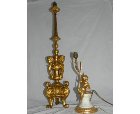 A gilt metal table lamp of tapered column form, the lower section adorned with cherubs, raised on lion paw feet, H: 85cm, tog