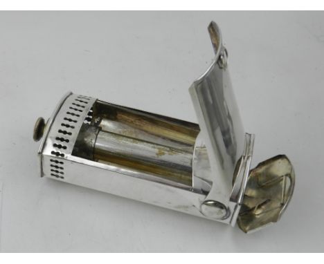 A late 19th century silver plated portable candle lamp, with a hinged cover and rectangular front plate, H. 17cm.