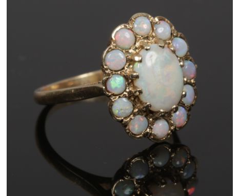 A 9ct gold opal cluster ring assayed London 1976, size O.