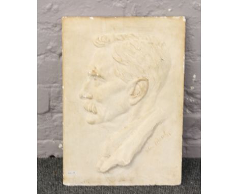 A plaster cast head and shoulders portrait bearing signature John Friend 37.