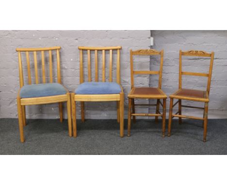 Two Ercol splat back dining chairs with upholstered seats, along with two Edwardian ladder back chairs.