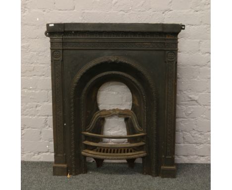 A Victorian cast iron fire surround.