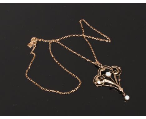 An Edwardian 9ct gold and opal lavaliere pendant on chain.