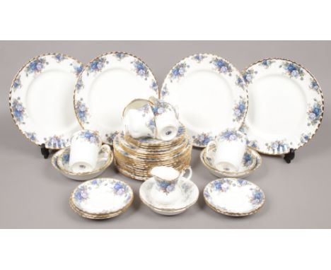 A Royal Albert bone china part tea and dinner service in the moonlight rose design, including cups and saucers, side plates, 