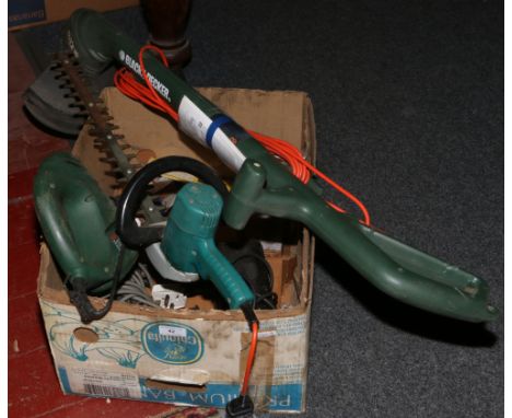 A box of 220 volt power tools to include Bosh saw, AEG and Black and Decker drills and hedge trimmer along with Reflex strimm