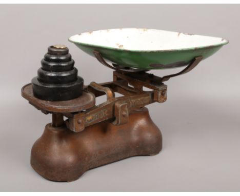 A set of W &amp; T Avery shop&nbsp; scales with enamel pan and graduated weights.