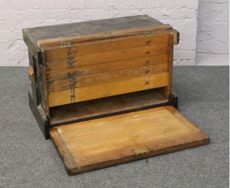 A Victorian painted cabinet makers tool chest with five drawers and drop down front.