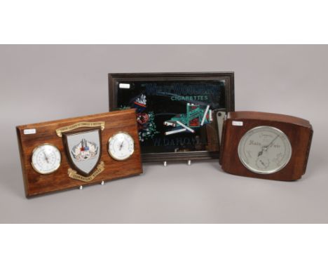 A group lot to include Wild Woodbine cigarettes advertising mirror, oak case Smith barometer and a wall mounted London Chambe