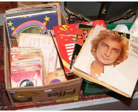 A box of L.P records and singles to include Elvis, Shirley Bassey, Barry Manilow etc.