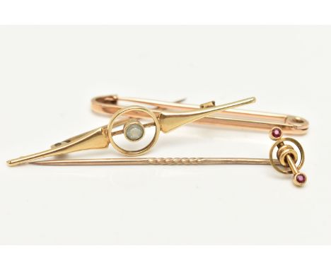 THREE EARLY 20TH CENTURY ITEMS OF JEWELLERY, the first a simple bar brooch, the second a tapered bar brooch with central circ